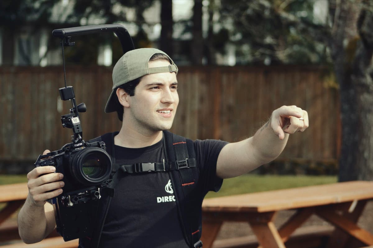 Caleb Kolstad directing on set with cinema camera