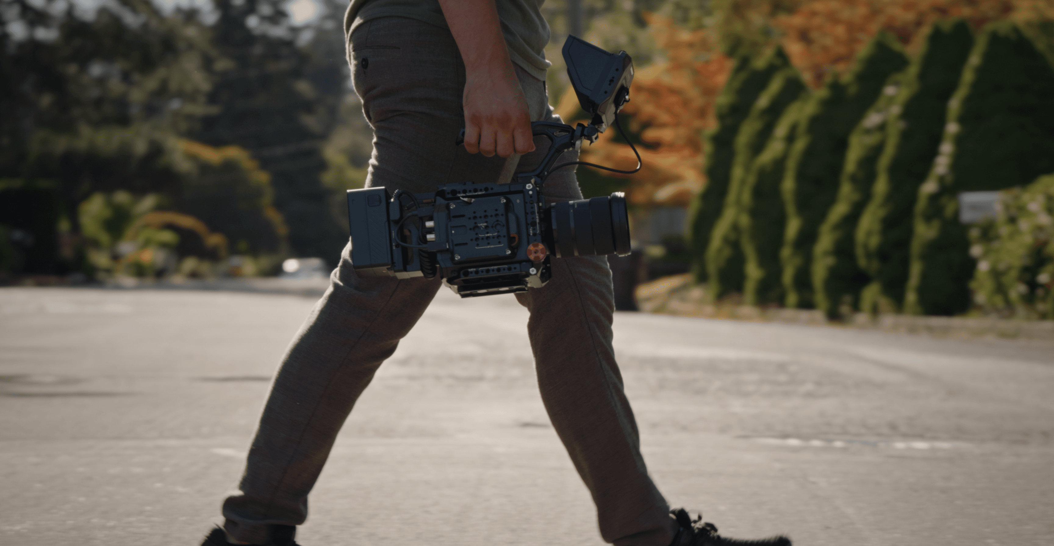 Filmmaker walking with cinema camera